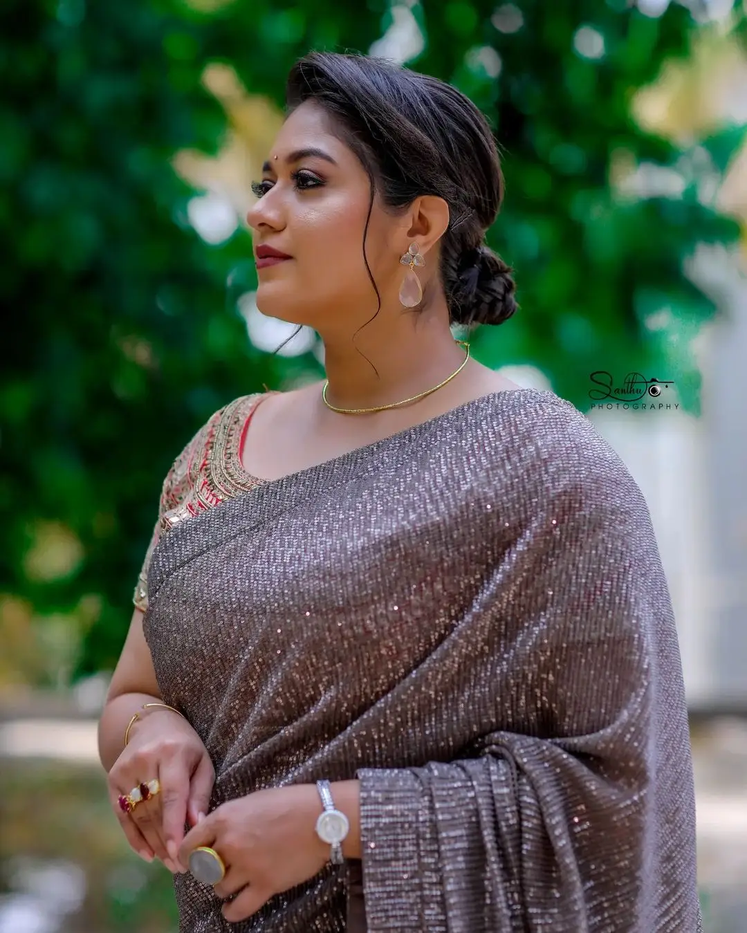 Meghana Raj Wearing Beautiful Earring Jewellery Black Saree